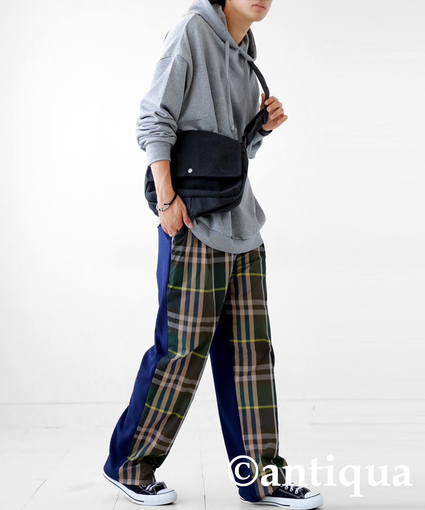 Different material switching check pants Men's