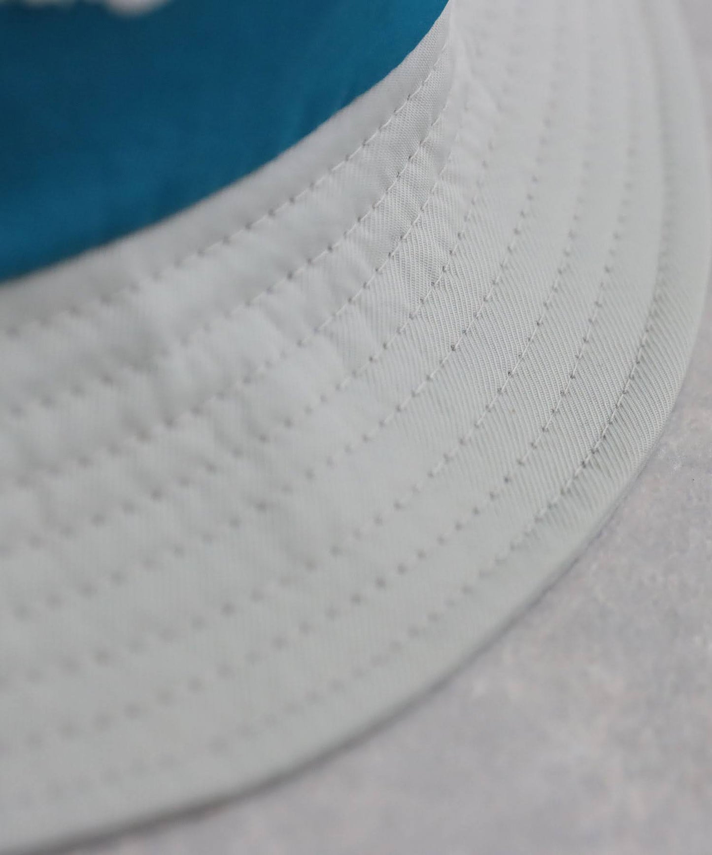 Ladies ANTIQUA GOLF × STCH Color-Coordinated Logo Bucket Hat