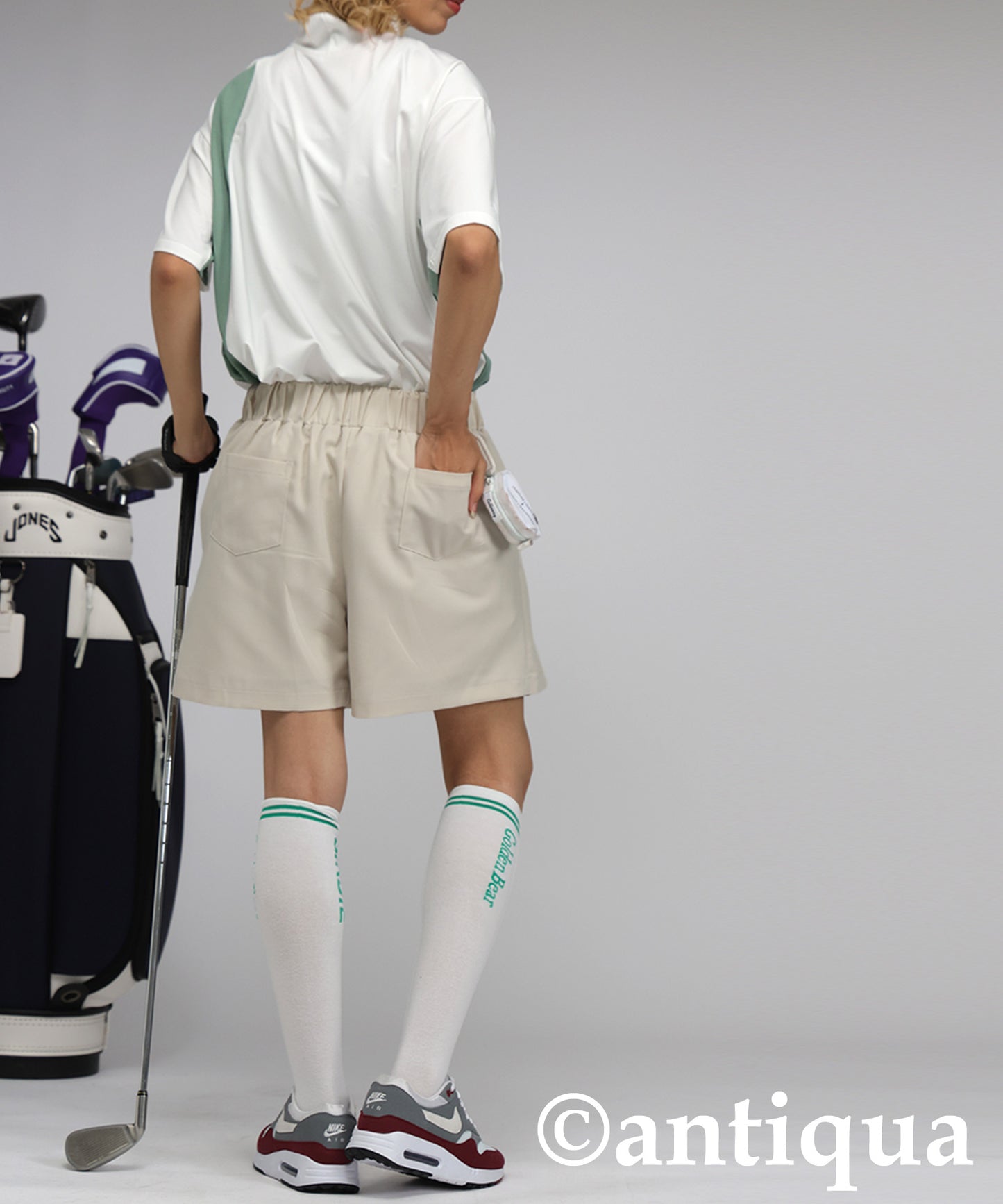 Ladies ANTIQUA GOLF × STCH Asymmetric Logo Top