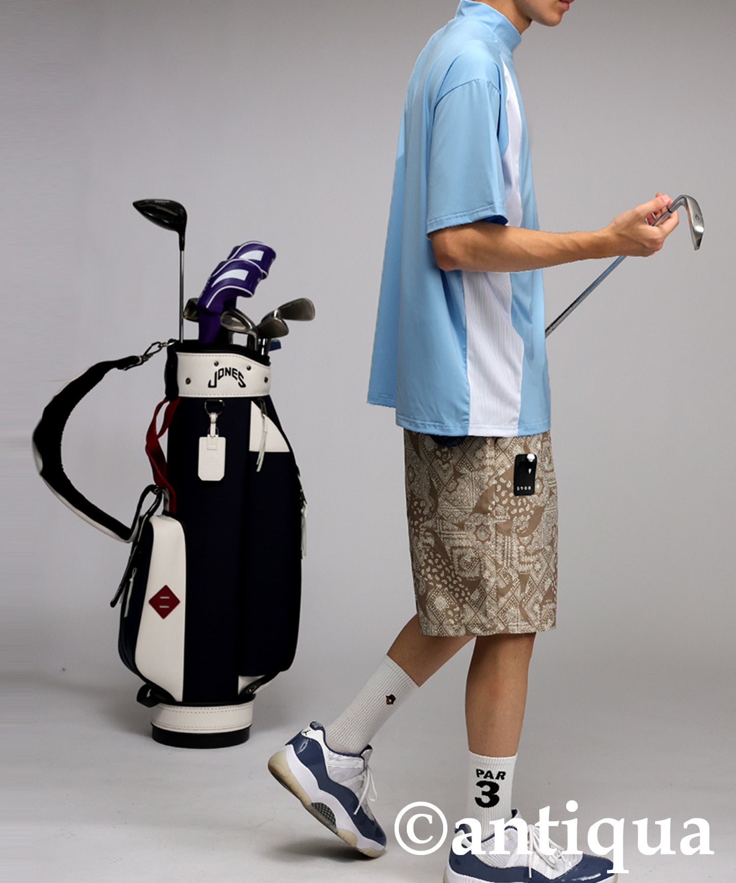 Men's ANTIQUA GOLF × STCH Asymmetric Logo Top