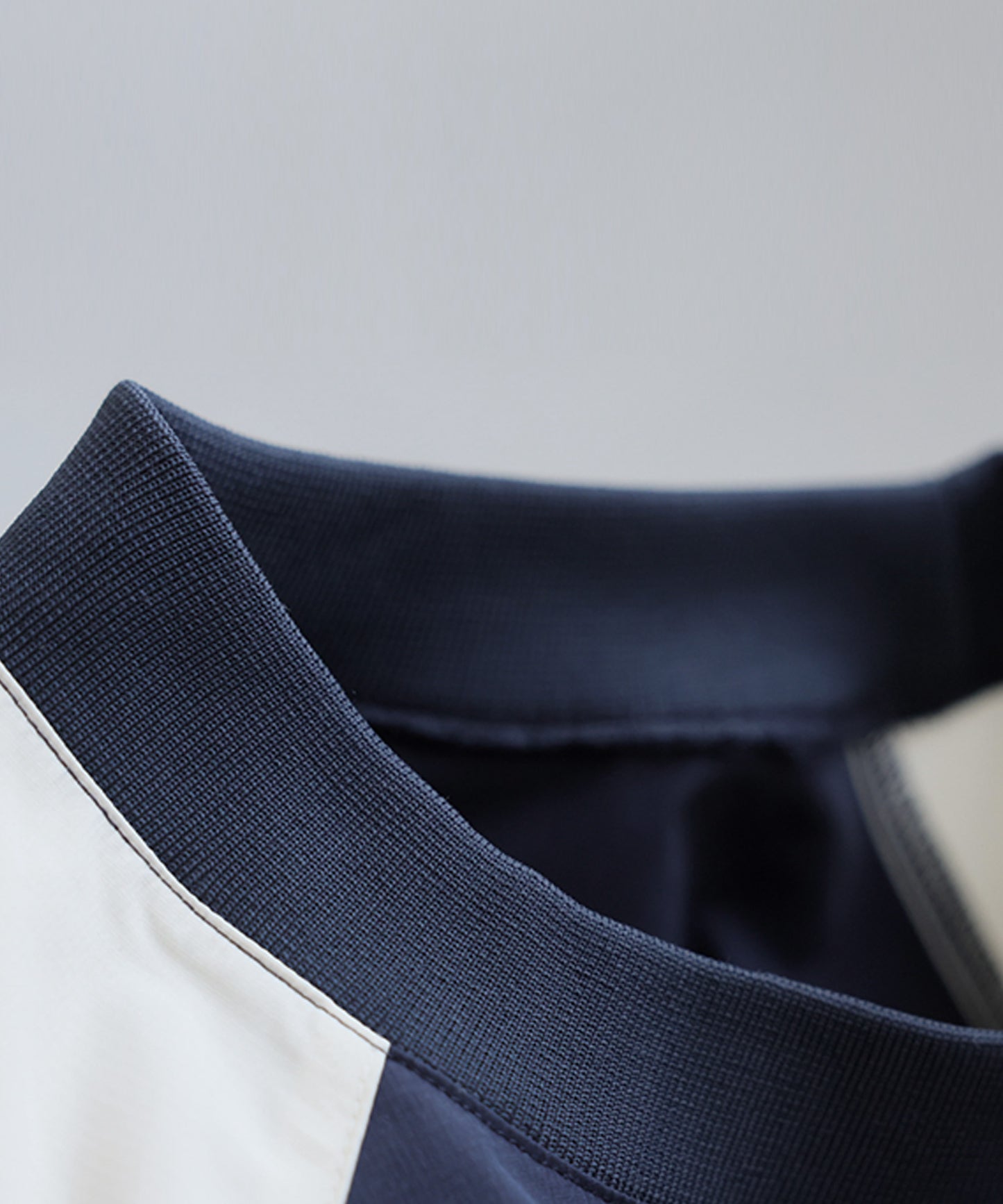 ANTIQUA GOLF×STCH Color-Blocked Tops Men's