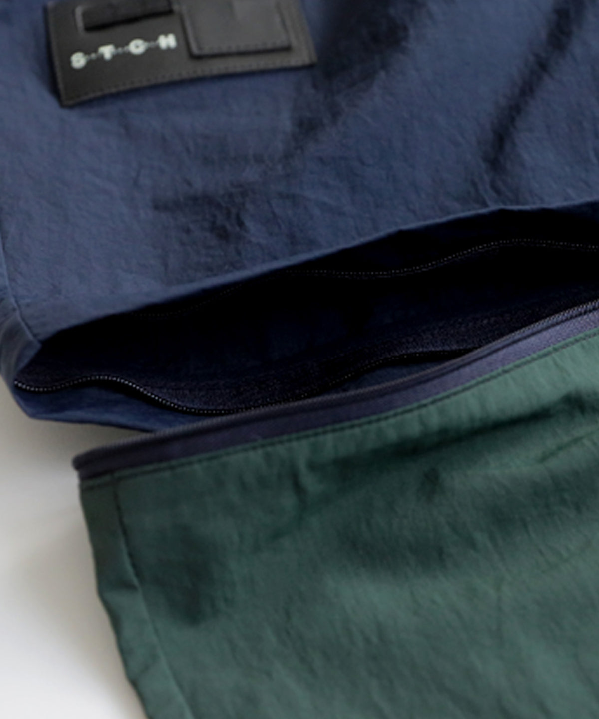 ANTIQUA GOLF×STCH 2-Way Color-Block Nylon Pants Men’s
