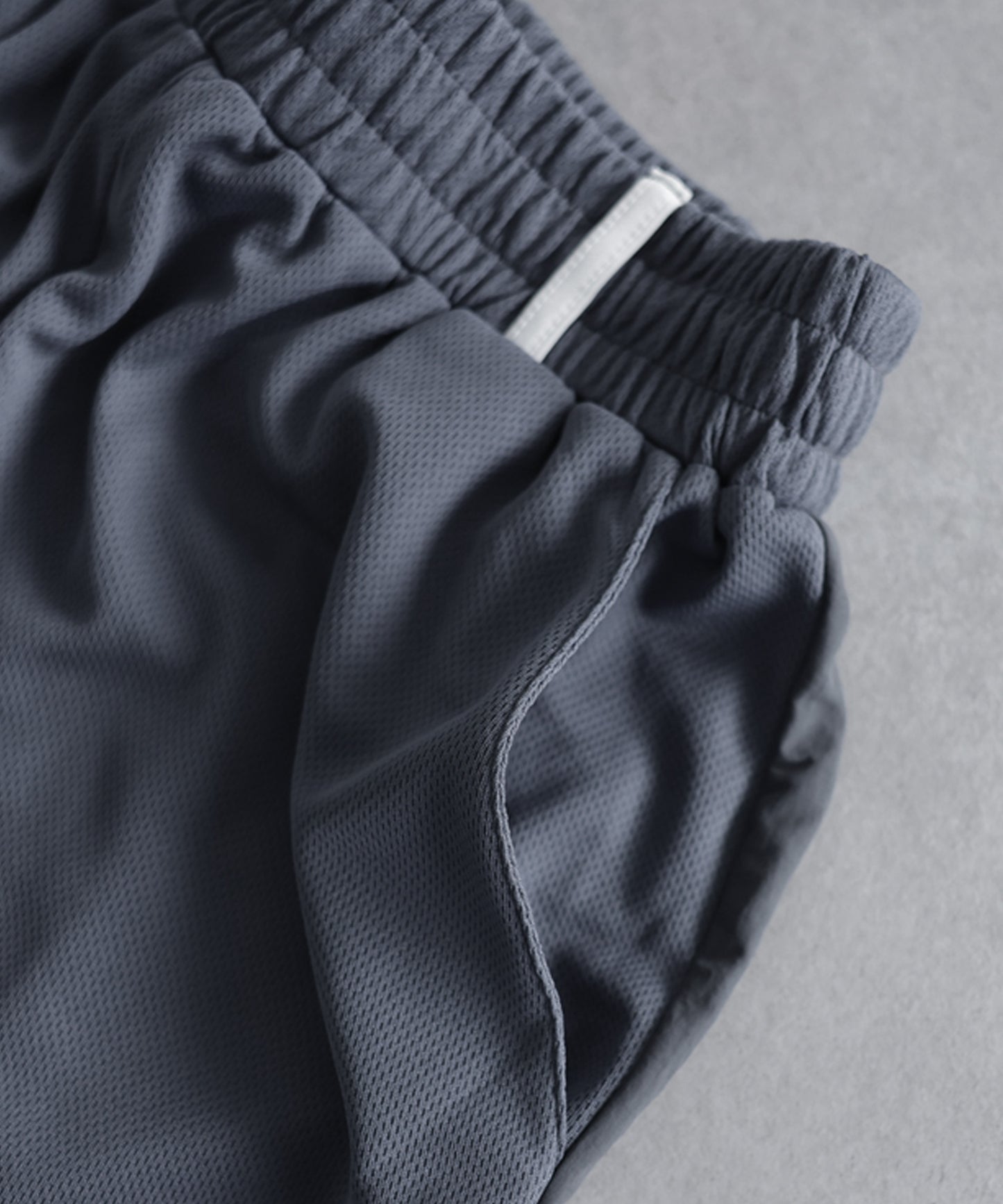 ANTIQUA GOLF×STCH Mixed-Material Mesh Logo Shorts Ladies